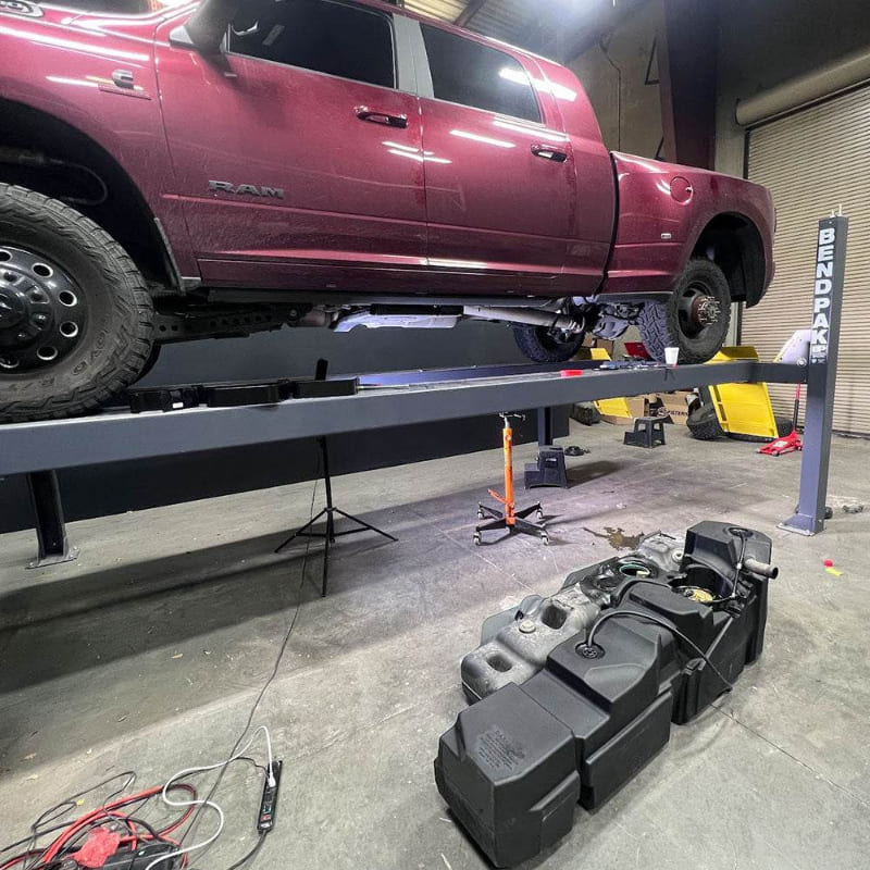 55 Gallon Replacement Fuel Tank for the 2006-2024 Dodge / Ram Mega Cab Short Bed - S&B being installed in a car