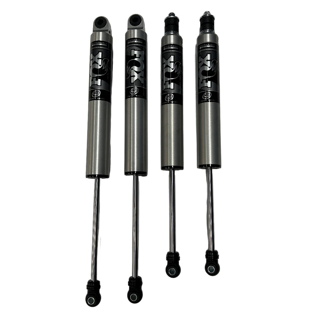 Four shock absorbers with FOX branding on a white background