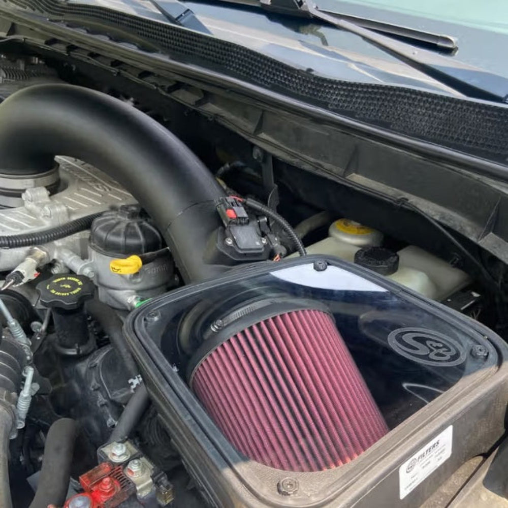 Cold Air Intake for 2016-2019 Nissan Titan XD 5.0L Cummins Diesel on a white background installed in the engine compartment of a vehicle.

 