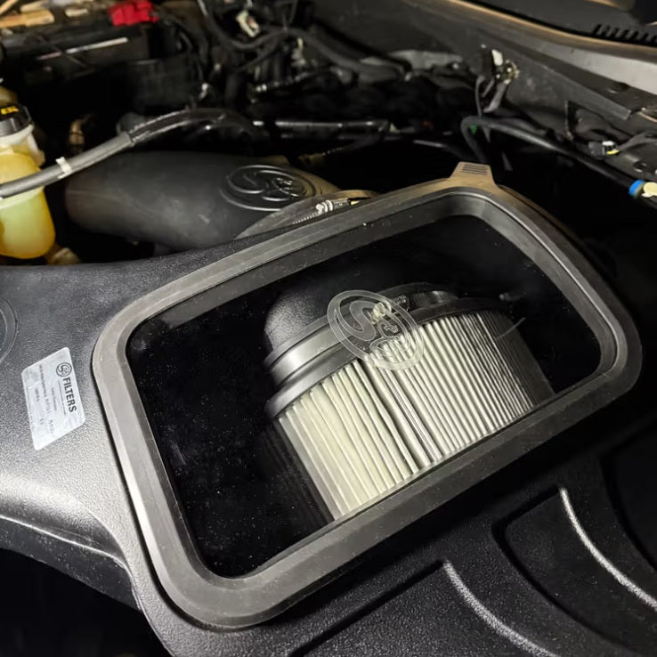 Dry Extendable Cold Air Intake for 2018-2025 Ford F-150 5.0L installed in the engine compartment of a vehicle.
