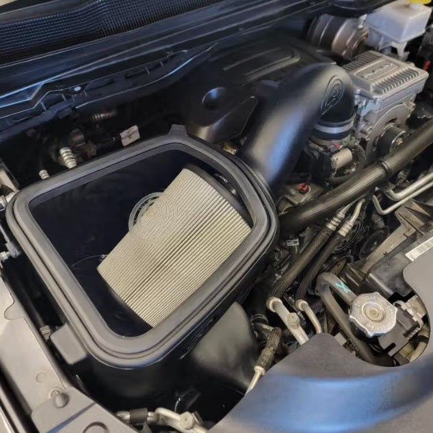 Dry Extendable Cold Air Intake for 2019-2024 Dodge Ram 1500 / 2500 / 3500 5.7L Hemi (New Body Style) installed in the engine compartment of a vehicle.

