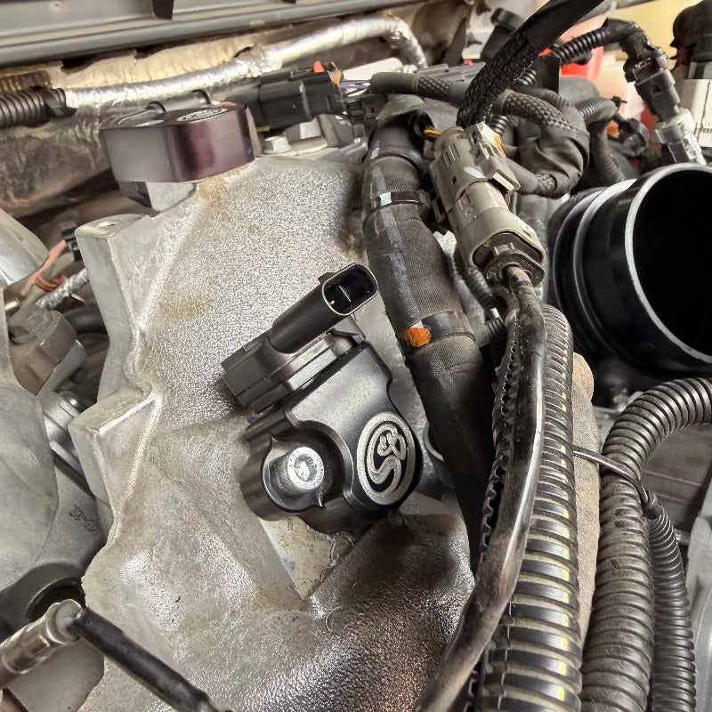 Close up of a Lower MAP Sensor Spacer Kit for 2024-2025 Chevy Silverado / GMC Sierra Duramax L5P 6.6L installed in a car
