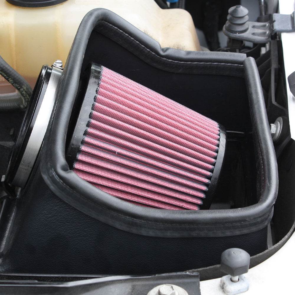 Close up of a JLT Cold Air Intake for 2010-2014 F-150/Raptor 6.2L - S&B installed in the engine compartment of a vehicle

