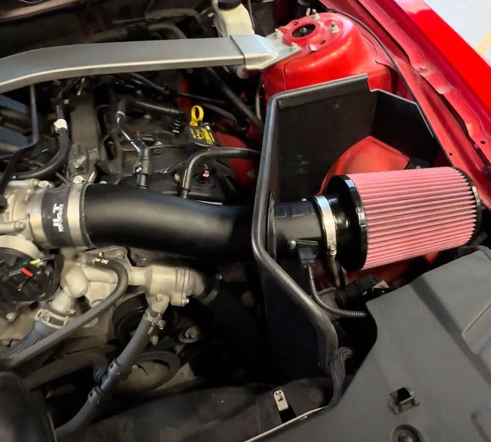 JLT Cold Air Intake for 2011-2014 Mustang V6 - S&B installed in the engine compartment of a vehicle
