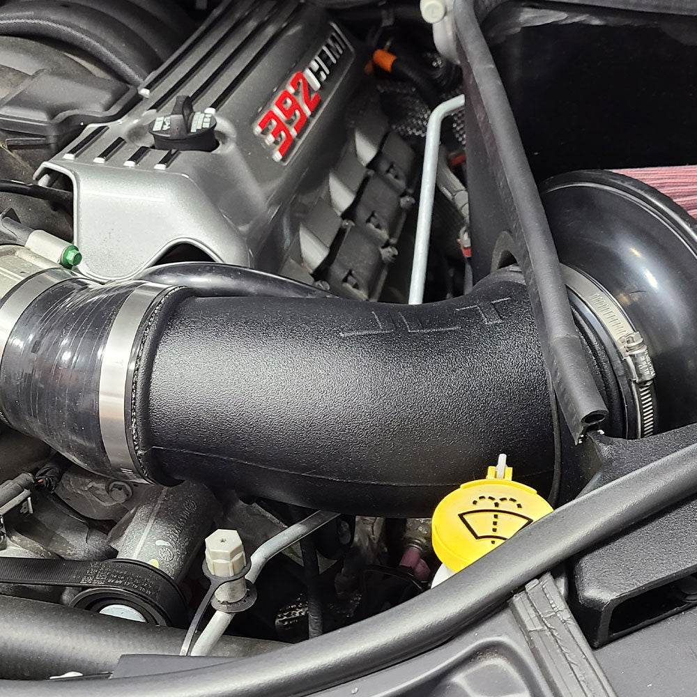 Close up JLT Cold Air Intake for 2021 Jeep Grand Cherokee SRT 6.4L - S&B installed in the engine compartment of a vehicle
