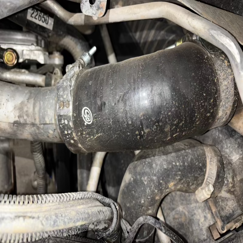 Close-up of an SB Filters Hot and Cold Side Boot Kit For 2004.5-2005 Chevy / GMC Duramax 6.6L (LLY) installed in a car