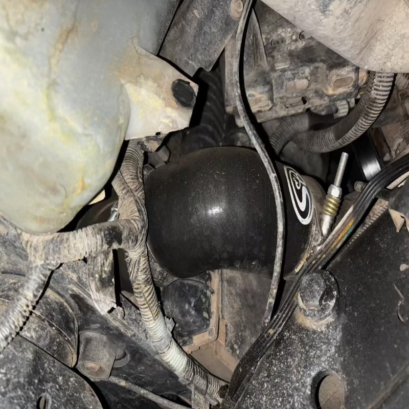 Close-up of an SB Filters Hot and Cold Side Boot Kit For 2004.5-2005 Chevy / GMC Duramax 6.6L (LLY) installed in a car