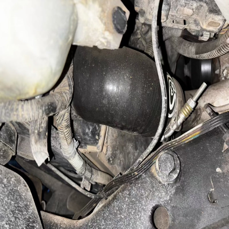 Close-up of an SB Filters Hot and Cold Side Boot Kit For 2004.5-2005 Chevy / GMC Duramax 6.6L (LLY) installed in a car