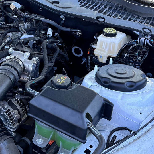 
  JLT Strut Covers For 2024-2025 Mustang - S&B installed in the engine compartment of a vehicle.
