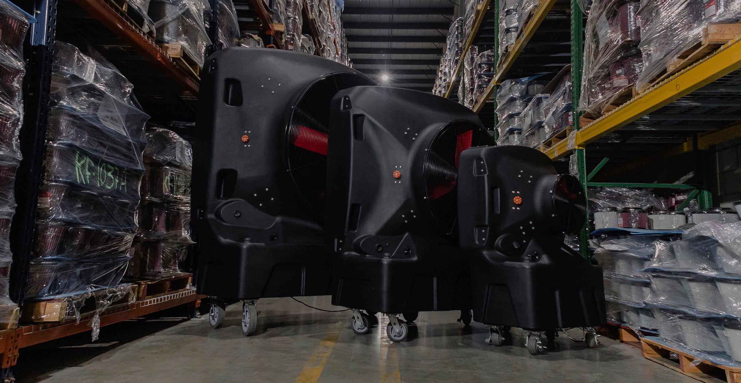large, medium and small evaporative cooler in a warehouse