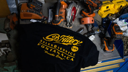 
  T-shirt with an SB Filters logo with different tools on the background
