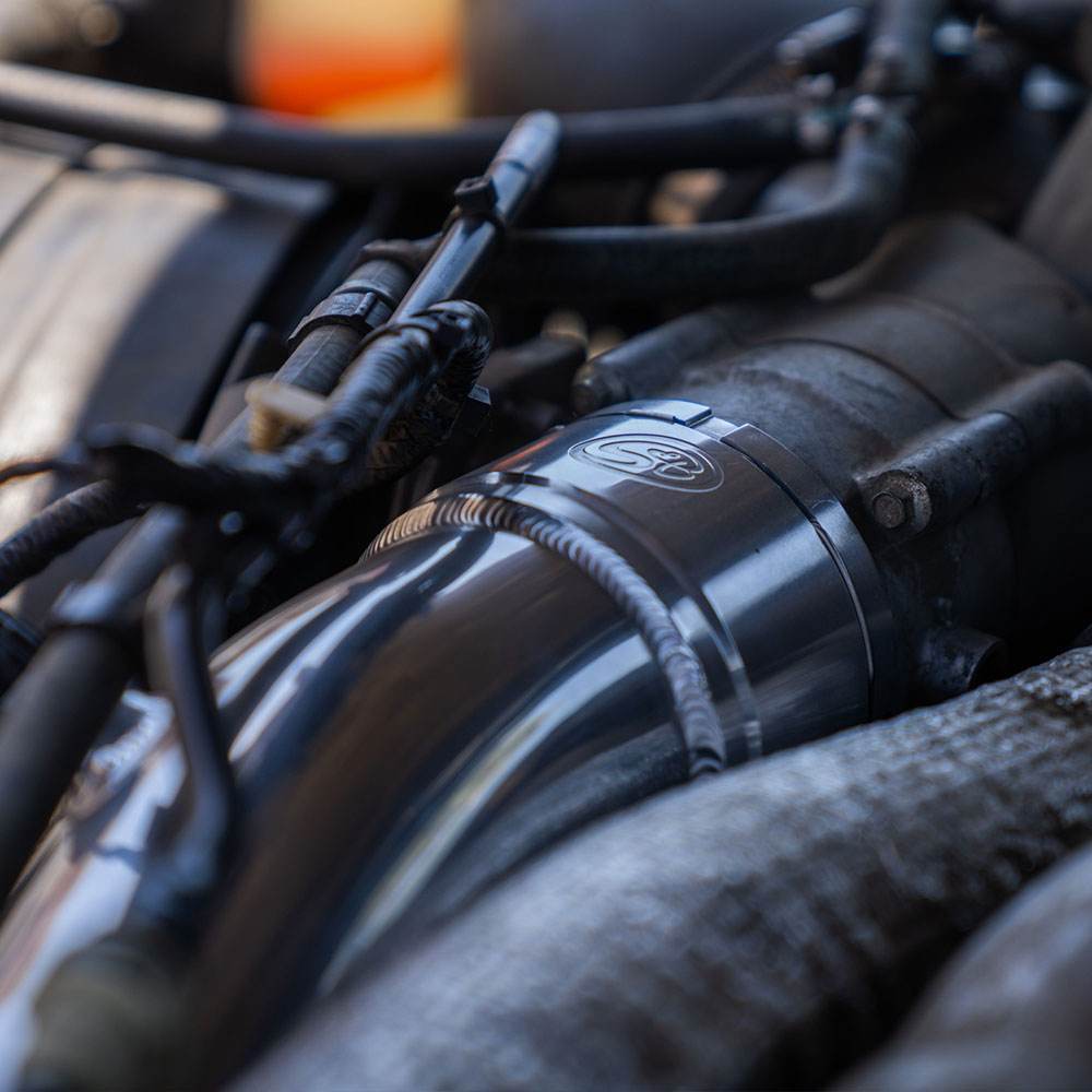 Close up SB Filters Cold Side Intercooler Pipe for 2023-2025 Ford Powerstroke F-450 / F-550 6.7L installed in a car